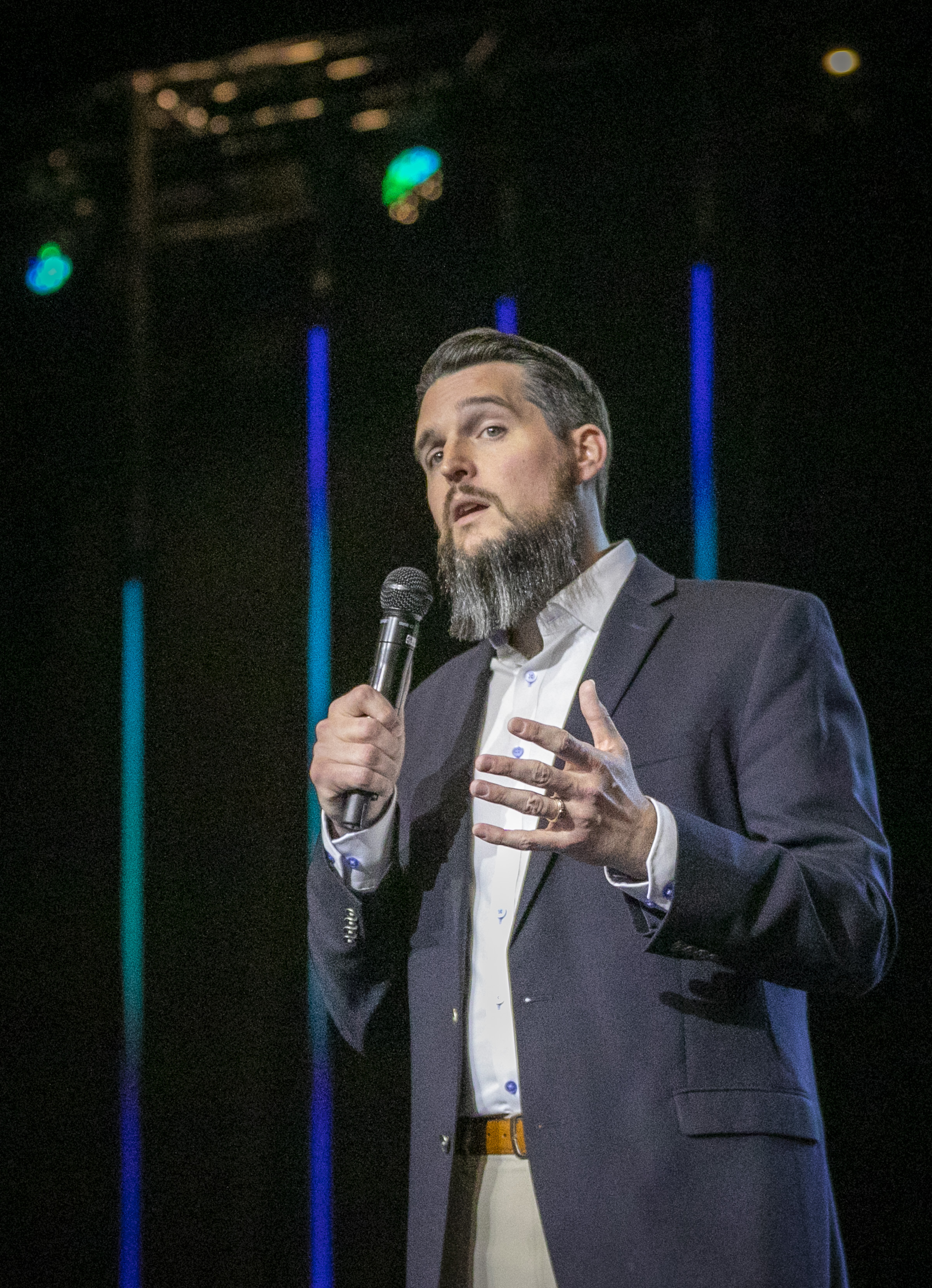 Erik Reagan speaking on stage