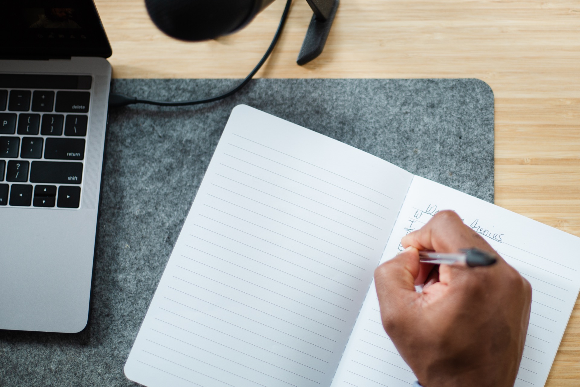 Hand writing in a notebook